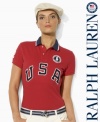 An essential short-sleeved polo shirt from Ralph Lauren is crafted in breathable cotton mesh with bold country embroidery, celebrating Team USA's participation in the 2012 Olympic Games.