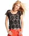 A ladylike classic gets a downtown makeover: INC's petite lace tee makes layering look wildly alluring.
