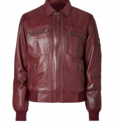 Lend an eye-catching edge to your slick outerwear favorites with McQ Alexander McQueens super soft oxblood lambskin jacket - Pointed collar, long sleeves, ribbed knit cuffs and hemline, zippered front, zippered front slit and patch pockets, zippered pocket on sleeve - Classic blouson silhouette - Wear with edgy knitwear, jeans and leather boots