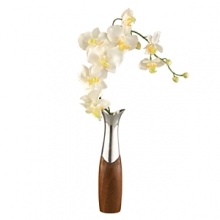 Bud vases let you create delicate, unassuming floral arrangements in any space. But our Cradle Bud Vase is special: instead of using conventional glass, we've married rich, warm wood and sparkling metal alloy into a form that will appeal to ladies and gentlemen alike. This duality is nimbly reinforced with our delightful silk orchid, at once refined and exotic.