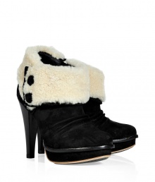 Show off your high style while staying warm in these ultra-chic shearling lined high heel booties from UGG Australia - Round toe, platform, crease-detailed front, shearling cuff with button details, chunky high heel, side zip closure - Pair with skinny jeans, an oversized cashmere sweater, and a down jacket or wool cape Show off your high style while staying warm in these ultra-chic shearling lined high heel booties from UGG Australia - Round toe, platform, crease-detailed front, shearling cuff with button details, chunky high heel, side zip closure - Pair with skinny jeans, an oversized cashmere sweater, and a down jacket or wool cape