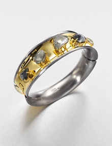 From the Miss Havisham Collection. Golden on the outside, gunmetal on the inside, this striking bangle is dotted with chunky doublets in dramatic tendril-like settings.CrystalWhite quartz, hematite and pyriteGoldtone and ruthenium platingDiameter, about 2.1Width, about .9Hinged, with magnetic closureMade in USA From the Miss Havisham Collection. Golden on the outside, gunmetal on the inside, this striking bangle is dotted with chunky doublets in dramatic tendril-like settings.CrystalWhite quartz, hematite and pyriteGoldtone and ruthenium platingDiameter, about 2.1Width, about .9Hinged, with magnetic closureMade in USA