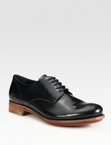 Bright contrast sole elevates the classic nature of this smooth leather lace-up.Leather upperLeather liningLeather soleMade in Italy