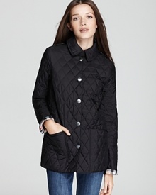 The cornerstone to any outerwear repertoire, this lightweight Burberry Brit jacket transitions into the new season with a classic quilted silhouette and iconic check lining. The cornerstone to any outerwear repertoire, this lightweight Burberry Brit jacket transitions into the new season with a classic quilted silhouette and iconic check lining.