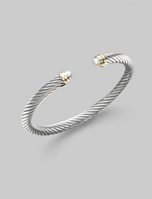 From the Cable Classics Collection. A signature Yurman cable of sterling silver, richly enhanced by white freshwater pearl end caps banded in 14k gold. White freshwater pearls Sterling silver and 14k yellow gold Cable, 5mm Diameter, about 2¼ Imported From the Cable Classics Collection. A signature Yurman cable of sterling silver, richly enhanced by white freshwater pearl end caps banded in 14k gold. White freshwater pearls Sterling silver and 14k yellow gold Cable, 5mm Diameter, about 2¼ Imported