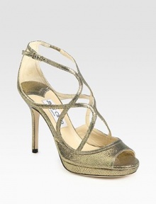 Shimmering, snake-embossed metallic leather and Lurex with dainty straps and a skinny heel. Self-covered heel, 4 (100mm)Covered platform, ½ (15mm)Compares to a 3½ heel (90mm)Metallic leather and Lurex upperLeather lining and solePadded insoleMade in ItalyOUR FIT MODEL RECOMMENDS ordering one half size up as this style runs small. Shimmering, snake-embossed metallic leather and Lurex with dainty straps and a skinny heel. Self-covered heel, 4 (100mm)Covered platform, ½ (15mm)Compares to a 3½ heel (90mm)Metallic leather and Lurex upperLeather lining and solePadded insoleMade in ItalyOUR FIT MODEL RECOMMENDS ordering one half size up as this style runs small.