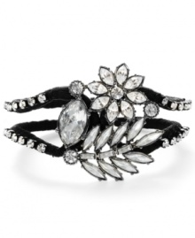 Art Deco appeal. Vintage design serves as intriguing inspiration for Betsey Johnson's exquisite crystal flower bracelet. Featuring faceted crystals and a black grosgrain ribbon, it's crafted in hematite tone mixed metal. Approximate length: 8 inches. Art Deco appeal. Vintage design serves as intriguing inspiration for Betsey Johnson's exquisite crystal flower bracelet. Featuring faceted crystals and a black grosgrain ribbon, it's crafted in hematite tone mixed metal. Approximate length: 8 inches.