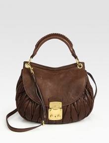Ruched lambskin style finished polished goldtone hardware.Top handle, 5 dropDetachable adjustable shoulder strap, 24¼-26½ dropFlap-and-clasp coffer closureMetal letter logo detailOne outside zip pocketOne inside zip pocketOne inside open pocketCotton/satin lining11W X 9¾H X 3DMade in Italy Ruched lambskin style finished polished goldtone hardware.Top handle, 5 dropDetachable adjustable shoulder strap, 24¼-26½ dropFlap-and-clasp coffer closureMetal letter logo detailOne outside zip pocketOne inside zip pocketOne inside open pocketCotton/satin lining11W X 9¾H X 3DMade in Italy