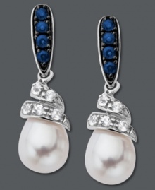 Dabble in a fresh, new design. These swirling drop earrings feature round-cut blue sapphires at the post (1/4 ct. t.w.) and round-cut white sapphires (1/5 ct. t.w) that cradle a shimmering cultured freshwater pearl (7 mm x 9 mm). Crafted in sterling silver. Approximate drop: 9/10 inch. Dabble in a fresh, new design. These swirling drop earrings feature round-cut blue sapphires at the post (1/4 ct. t.w.) and round-cut white sapphires (1/5 ct. t.w) that cradle a shimmering cultured freshwater pearl (7 mm x 9 mm). Crafted in sterling silver. Approximate drop: 9/10 inch.