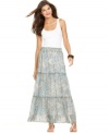 An ethereal print on sheer fabric and tiered panels lend a breezy look to this Ellen Tracy skirt. Pair it with a white tank top and sandals for bohemian chic!