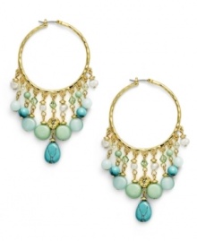 Think spring. The pastel combination of reconstituted turquoise, freshwater pearls (4 mm), and jade-colored beads exude serenity on the Green Valley hoop earrings from Lauren by Ralph Lauren. Setting and click-it clasp crafted in gold tone mixed metal. Approximate drop: 3 inches. Approximate diameter: 1-1/4 inches. Think spring. The pastel combination of reconstituted turquoise, freshwater pearls (4 mm), and jade-colored beads exude serenity on the Green Valley hoop earrings from Lauren by Ralph Lauren. Setting and click-it clasp crafted in gold tone mixed metal. Approximate drop: 3 inches. Approximate diameter: 1-1/4 inches.