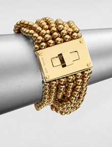 From the Modern Classics Collection. Bold and beautiful strands of polished beads with a glowing golden finish are connected to a striking turn-lock clasp in this sophisticated design.GoldtoneLength, about 7Width, about 1.75Turn-lock claspImported From the Modern Classics Collection. Bold and beautiful strands of polished beads with a glowing golden finish are connected to a striking turn-lock clasp in this sophisticated design.GoldtoneLength, about 7Width, about 1.75Turn-lock claspImported