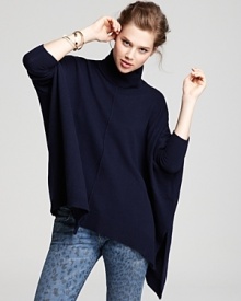 Rendered with a warm turtleneck, this oversized Aqua Cashmere sweater flows fluidly over your silhouette into an asymmetric hem. Seam detail at the front and back lends the perfect touch of modernity. Rendered with a warm turtleneck, this oversized Aqua Cashmere sweater flows fluidly over your silhouette into an asymmetric hem. Seam detail at the front and back lends the perfect touch of modernity.