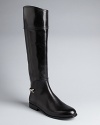 These tall, stately Tory Burch riding boots sum up her uptown-downtown signature style.