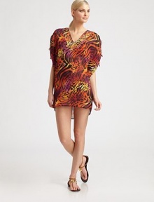 Paillettes adorn the neckline as the bold print gives this coverup a must-have status.Plunging necklineRuched and tie details on flutter sleevesPolyesterHand washImported Paillettes adorn the neckline as the bold print gives this coverup a must-have status.Plunging necklineRuched and tie details on flutter sleevesPolyesterHand washImported