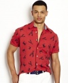 Put your happy face on. It'll be hard for anyone to be crabby whenever you're sporting this Nautica shirt that combines fun and fashion for a flawless look.