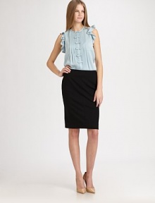 Sweet bows line the front of this pleated blouse, with ruffled overlay for a feminine appeal. JewelneckSleeveless with ruffled overlayButton front with hidden placketAbout 24 from shoulder to hem95% silk/5% spandexDry cleanImportedModel shown is 5'11 (180cm) wearing US size 4. Sweet bows line the front of this pleated blouse, with ruffled overlay for a feminine appeal. JewelneckSleeveless with ruffled overlayButton front with hidden placketAbout 24 from shoulder to hem95% silk/5% spandexDry cleanImportedModel shown is 5'11 (180cm) wearing US size 4.