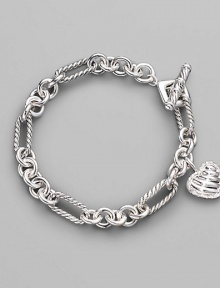 From the Cable Heart Collection. A lovely cable heart framed in pavé diamonds hangs from a figaro chain bracelet of sterling silver. Diamonds, 0.19 tcw Sterling silver Length, about 7½ Toggle closure Imported From the Cable Heart Collection. A lovely cable heart framed in pavé diamonds hangs from a figaro chain bracelet of sterling silver. Diamonds, 0.19 tcw Sterling silver Length, about 7½ Toggle closure Imported