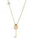 Quintessentially quirky! Betsey Johnson's long pendant necklace features a charming frog as well as a key. Embellished with glittering crystals and a bow, it's crafted in antique gold tone mixed metal. Approximate length: 34 inches + 3-inch extender. Approximate drop: 3 inches.