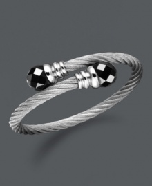 Wrap your wrists in polished perfection. This coil-shaped bangle bracelet features black onyx beads (12 mm) set in stainless steel. Approximate length: 8 inches. Wrap your wrists in polished perfection. This coil-shaped bangle bracelet features black onyx beads (12 mm) set in stainless steel. Approximate length: 8 inches.