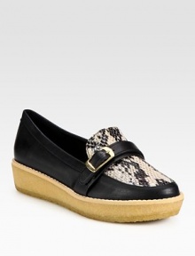 A rubber wedge go-to of faux leather and mock python with an adjustable buckle strap. Rubber heel, 1¼ (30mm)Rubber platform, 1 (25mm)Compares to a ¼ heel (5mm)Faux leather and faux python upperFaux leather liningRubber solePadded insoleImported A rubber wedge go-to of faux leather and mock python with an adjustable buckle strap. Rubber heel, 1¼ (30mm)Rubber platform, 1 (25mm)Compares to a ¼ heel (5mm)Faux leather and faux python upperFaux leather liningRubber solePadded insoleImported