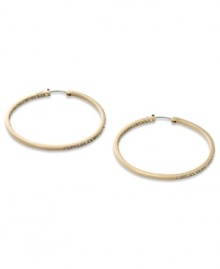 These timeless hoop earrings from Fossil get a glitzy upgrade with black diamond crystal accents. Crafted in shiny gold tone mixed metal. Approximate diameter: 2 inches. These timeless hoop earrings from Fossil get a glitzy upgrade with black diamond crystal accents. Crafted in shiny gold tone mixed metal. Approximate diameter: 2 inches.