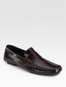 Lustrous leather driver, highlighting expert Italian craftsmanship and attention to detail, with a penny keeper accent and a supportive rubber sole.Leather upperLeather liningPadded insoleRubber soleMade in Italy Lustrous leather driver, highlighting expert Italian craftsmanship and attention to detail, with a penny keeper accent and a supportive rubber sole.Leather upperLeather liningPadded insoleRubber soleMade in Italy
