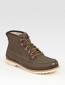 Whether hiking the trails or traipsing around the city streets, this rustic-inspired style lends a contemporary touch with leather and canvas upper for long-lasting wear.Leather/canvas upper Leather liningPadded insoleRubber soleImported