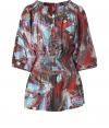 Elegant blouse in pure silk - Fashionable all-over print in a feather pattern - In the background color rust, with light blue, white and anthracite - Pretty tunic cut with wide 3/4-length sleeves - Fashionable details: The round neck, peasant style (Carmen look) cut and  waist are smocked - The blouse is cut long and falls softly with a silky sheen - Wear with the current 70s style wide flared trousers