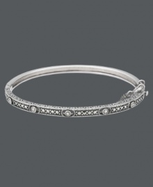 Add a slice of style with this thin, slip of a bangle. Genevieve & Grace's design highlights an intricate pattern that shines with the addition of glittering marcasite accents. Crafted in sterling silver. Approximate diameter: 2-1/2 inches. Add a slice of style with this thin, slip of a bangle. Genevieve & Grace's design highlights an intricate pattern that shines with the addition of glittering marcasite accents. Crafted in sterling silver. Approximate diameter: 2-1/2 inches.