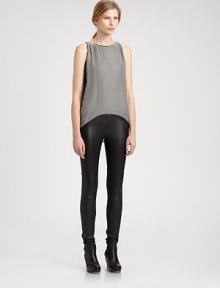 Get city-ready in this structured tank, styled by a hi-lo hem and figure-skimming back pleats. RoundneckSleevelessHi-lo hemBack pleatingViscose/cottonDry cleanMade in USA of Italian fabricModel shown is 5'10 (177cm) wearing US size Small.