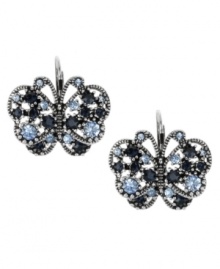 Spread your style wings with these too-cute butterfly earrings from Betsey Johnson. This cool blue design features rhodium-plating and eye-catching crystals accents. Approximate drop: 1 inch. Spread your style wings with these too-cute butterfly earrings from Betsey Johnson. This cool blue design features rhodium-plating and eye-catching crystals accents. Approximate drop: 1 inch.