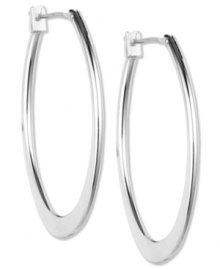 Big-time fashion. Anne Klein's oval-shaped hoops are a must-own this season. Crafted in imitation rhodium-plated mixed metal. Approximate diameter: 3/4 inch. Big-time fashion. Anne Klein's oval-shaped hoops are a must-own this season. Crafted in imitation rhodium-plated mixed metal. Approximate diameter: 3/4 inch.