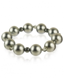 A splendid mix of shimmer. This stunning bracelet combines shell-based cultured freshwater pearls (14 mm), sparkling hematite (12-3/8 ct. t.w.) and Swarovski Elements. Bracelet stretches to fit wrist. Approximate length: 7-1/2 inches. A splendid mix of shimmer. This stunning bracelet combines shell-based cultured freshwater pearls (14 mm), sparkling hematite (12-3/8 ct. t.w.) and Swarovski Elements. Bracelet stretches to fit wrist. Approximate length: 7-1/2 inches.