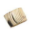 Catch the next wave of great style with Alfani's wavy stretch bracelet. Wear it to work or on weekends for a unique, eye-catching look. Crafted in gold tone mixed metal. Bracelet stretches to fit wrist. Approximate diameter: 7-1/2 inches.