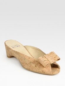 Natural cork style with a demi wedge, peep toe and timeless bow adornment. Self-covered wedge, 1 (25mm)Cork upperSuede liningExclusive rubber solePadded insoleImported Natural cork style with a demi wedge, peep toe and timeless bow adornment. Self-covered wedge, 1 (25mm)Cork upperSuede liningExclusive rubber solePadded insoleImported
