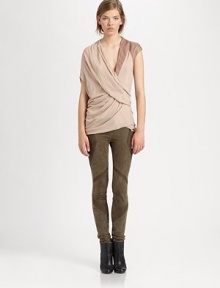This modern marvel has a contrasting leather cap sleeve, single short dolman sleeve and an asymmetrical back hem. Crossover v-neckSingle leather cap sleeveSingle short dolman sleeveAsymmetrical back hemViscoseDry cleanImported of Italian fabricModel shown is 5'10 (177cm) wearing US size Small. This modern marvel has a contrasting leather cap sleeve, single short dolman sleeve and an asymmetrical back hem. Crossover v-neckSingle leather cap sleeveSingle short dolman sleeveAsymmetrical back hemViscoseDry cleanImported of Italian fabricModel shown is 5'10 (177cm) wearing US size Small.