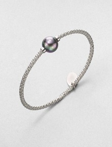 A stunning grey pearl on a textured, rhodium-plated stainless steel bangle. 12mm organic grey round man-made pearlRhodium-plated stainless steelDiameter, about 2.5Slip-on styleImported A stunning grey pearl on a textured, rhodium-plated stainless steel bangle. 12mm organic grey round man-made pearlRhodium-plated stainless steelDiameter, about 2.5Slip-on styleImported