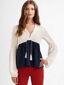 Chic colorblocking elevates this fluid silk topper crafted in a breezy blouson silhouette.V necklineLace-up placketEmpire waistFlared from bust to hemGathered blouson sleevesAbout 24 from shoulder to hemSilkDry cleanImportedModel shown is 5'9 (175cm) wearing US size Small. Chic colorblocking elevates this fluid silk topper crafted in a breezy blouson silhouette.V necklineLace-up placketEmpire waistFlared from bust to hemGathered blouson sleevesAbout 24 from shoulder to hemSilkDry cleanImportedModel shown is 5'9 (175cm) wearing US size Small.