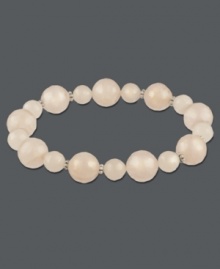 Slip-on style for instant sophistication. Polished rose quartz beads (122-3/8 ct. t.w.) comprise this beautiful stretch style. Set in sterling silver. Approximate length: 7-1/2 inches. Slip-on style for instant sophistication. Polished rose quartz beads (122-3/8 ct. t.w.) comprise this beautiful stretch style. Set in sterling silver. Approximate length: 7-1/2 inches.