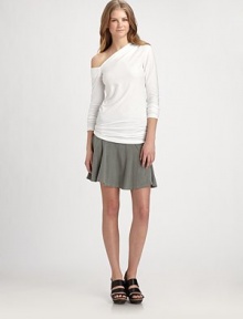Soft and slouchy stretch knit in a sexy, shoulder-baring silhouette.Asymmetric necklineLong sleevesPullover style94% cotton/6% lycraDry cleanMade in USA of imported fabricModel shown is 5'11 (180cm) wearing US size Small. Soft and slouchy stretch knit in a sexy, shoulder-baring silhouette.Asymmetric necklineLong sleevesPullover style94% cotton/6% lycraDry cleanMade in USA of imported fabricModel shown is 5'11 (180cm) wearing US size Small.