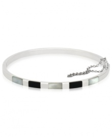 The essence of style and elegance, polished bangle looks stunning solo as well as layered with other bangles. Crafted in sterling silver with rectangular accents in onyx and Mother of Pearl. Approximate diameter: 2-5/16 x 2-5/8 inches. The essence of style and elegance, polished bangle looks stunning solo as well as layered with other bangles. Crafted in sterling silver with rectangular accents in onyx and Mother of Pearl. Approximate diameter: 2-5/16 x 2-5/8 inches.