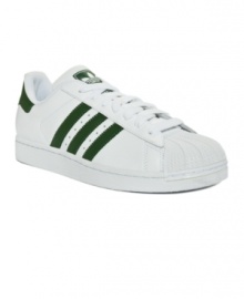 A classic that never quits, adidas Superstar men's sneakers are back in action with all of their iconic old school charm in smooth full grain leather with standout stripes. A classic that never quits, adidas Superstar men's sneakers are back in action with all of their iconic old school charm in smooth full grain leather with standout stripes.