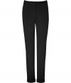 Your office-ready look just got more stylish with these cuffed skinny pants from Donna Karan - Flat front, skinny leg, cuffed hem - Wear with a tie-neck blouse and embellished ballet flats