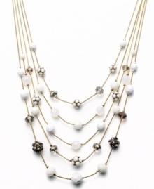 Try a fresh palette of color to brighten your look. This five-row illusion necklace by INC International Concepts combines plastic white beads, black glass beads, plastic fireballs, glass fireballs, white plastic beads, and frosted plastic beads. Set in gold tone mixed metal. Approximate length: 18 inches + 3-inch extender. Approximate drop: 3-1/2 inches.