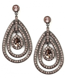La vie en rose. A delicate rose hue defines these sparkling orbital drop earrings from Givenchy. Adorned with glittering crystals and glass accents, they're crafted in hematite tone mixed metal. Approximate drop: 2-1/4 inches. La vie en rose. A delicate rose hue defines these sparkling orbital drop earrings from Givenchy. Adorned with glittering crystals and glass accents, they're crafted in hematite tone mixed metal. Approximate drop: 2-1/4 inches.