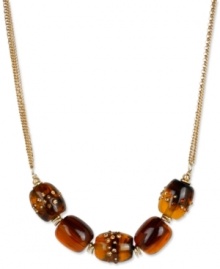 Add uniqueness to your look with this barrel-strung necklace from Kenneth Cole New York. Carved in tortoise resin, they're embellished with pave crystal accents. Crafted in gold tone mixed metal. Approximate length: 18 inches + 3-inch extender. Approximate drop: 3/4 inch. Add uniqueness to your look with this barrel-strung necklace from Kenneth Cole New York. Carved in tortoise resin, they're embellished with pave crystal accents. Crafted in gold tone mixed metal. Approximate length: 18 inches + 3-inch extender. Approximate drop: 3/4 inch.