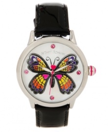 Free from a cocoon of boring accessories with this darling watch by Betsey Johnson. Crafted of black leather strap and round silver tone mixed metal case. White mother-of-pearl dial features large multicolor butterfly graphic, pink dot markers at twelve, three, six and nine o'clock, silver tone hour and minute hands, signature fuchsia second hand and logo at twelve o'clock. Quartz movement. Water resistant to 30 meters. Two-year limited warranty. Free from a cocoon of boring accessories with this darling watch by Betsey Johnson. Crafted of black leather strap and round silver tone mixed metal case. White mother-of-pearl dial features large multicolor butterfly graphic, pink dot markers at twelve, three, six and nine o'clock, silver tone hour and minute hands, signature fuchsia second hand and logo at twelve o'clock. Quartz movement. Water resistant to 30 meters. Two-year limited warranty.