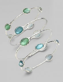 From the Silver Wonderland Collection. Faceted ovals of quartz in soft denim blue are backed by discs of mother-of-pearl and set in a graceful bangle of hammered sterling silver. Quartz and mother-of-pearl Sterling silver Diameter, about 2¾ ImportedPlease note: Bracelets sold separately. From the Silver Wonderland Collection. Faceted ovals of quartz in soft denim blue are backed by discs of mother-of-pearl and set in a graceful bangle of hammered sterling silver. Quartz and mother-of-pearl Sterling silver Diameter, about 2¾ ImportedPlease note: Bracelets sold separately.