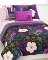 Floral frenzy. Bold, blooming flowers in vibrant hues adorn this Chloe comforter set for a burst of fun. Reverses to a stripe pattern in coordinating tones. Comes complete with sheet set and decorative pillows for a look full of flair. (Clearance)